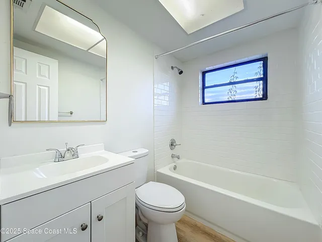a bathroom with a sink a toilet and a bathtub