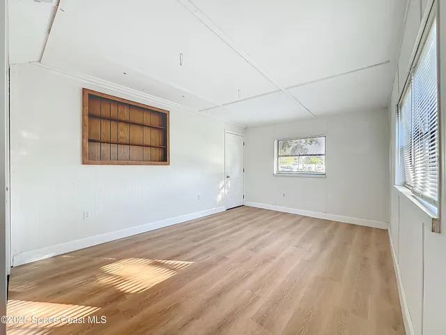 a view of an empty room and window
