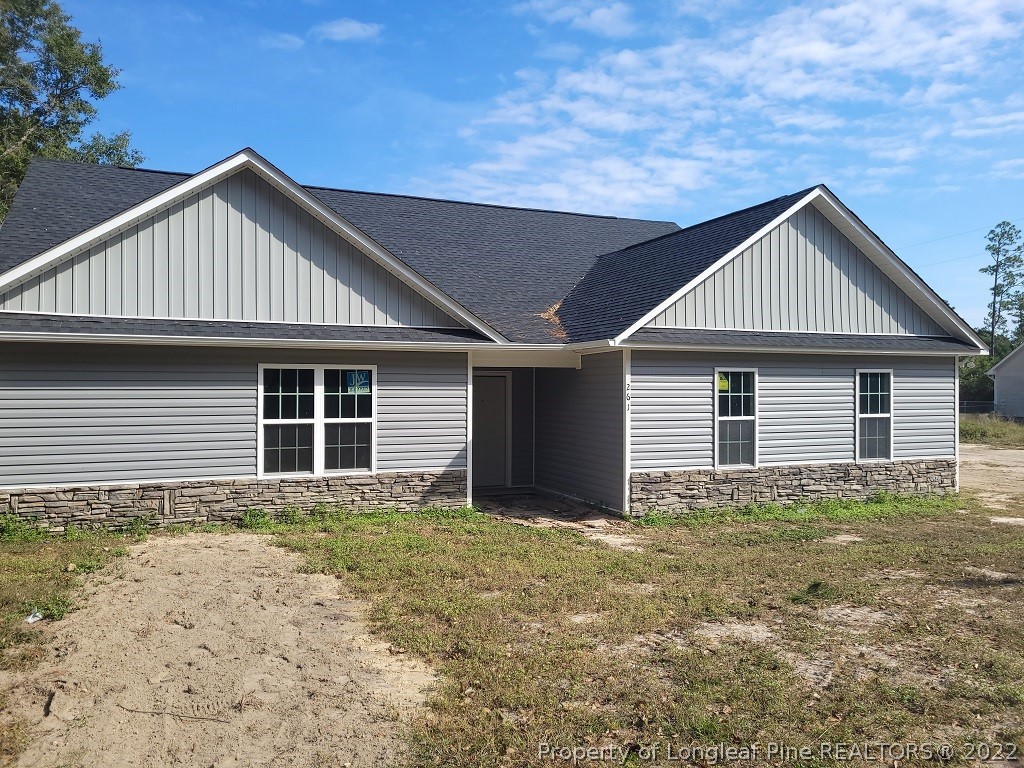 261 Tc Jones Road Raeford, NC 28376 - Photo 1 of 6 a front view of a house with yard