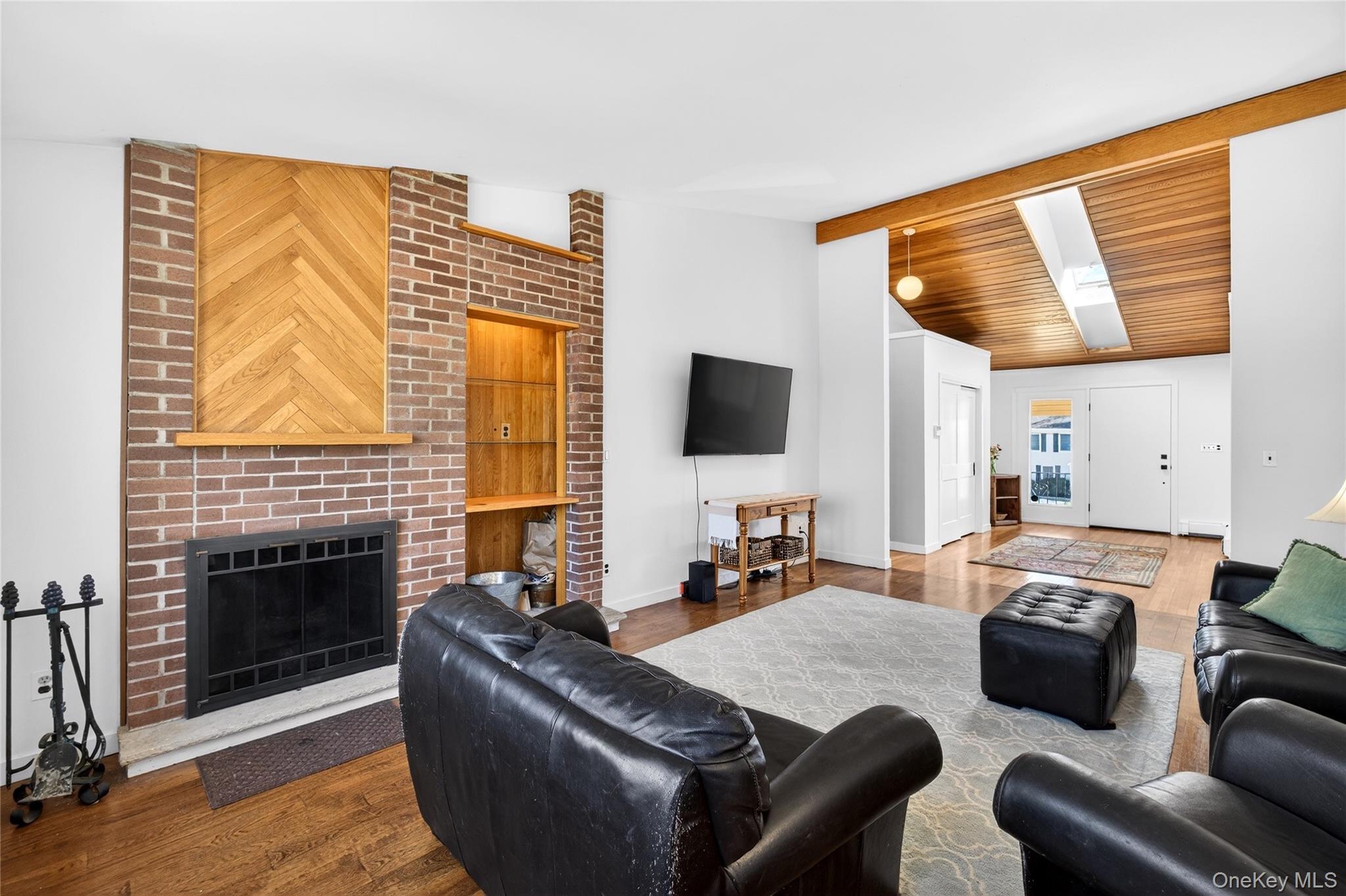 80 Ridgeview Drive Pleasantville, NY 10570 - Photo 5 of 45 Alternate View of the Living Room facing the front foyer with plenty of light and cedar ceiling.