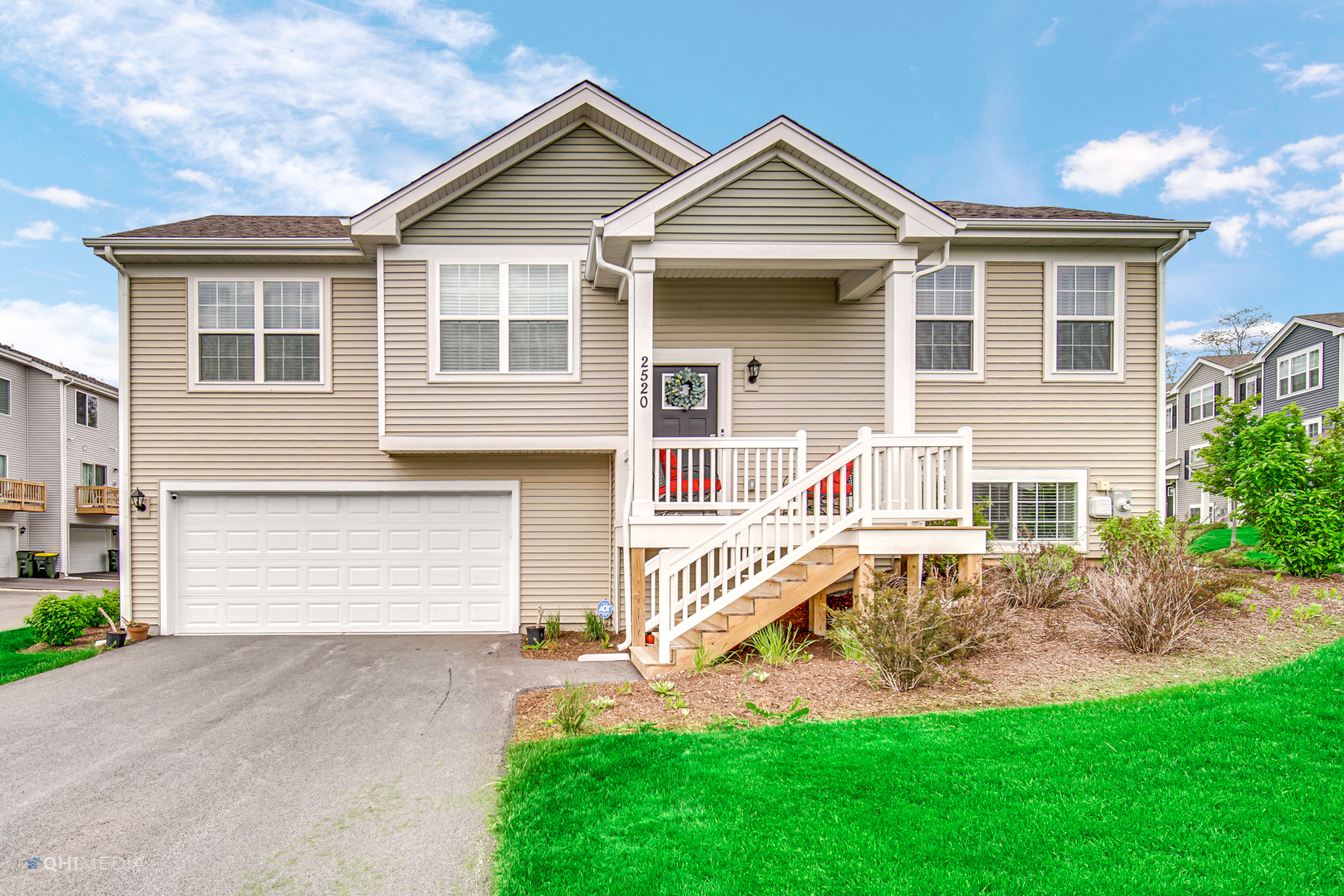 a front view of a house with a yard and porch