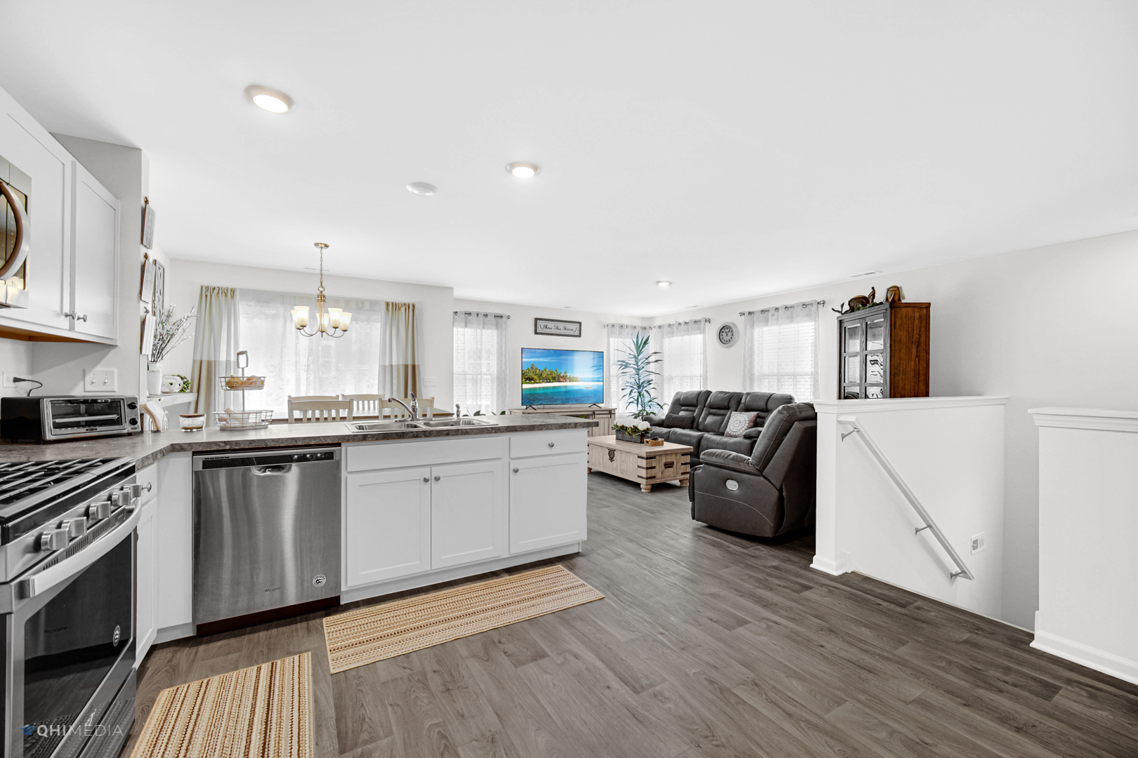 2520 Alison Avenue Pingree Grove, IL 60140 - Photo 5 of 19 a kitchen with granite countertop a stove top oven a sink dishwasher and white cabinets with wooden floor