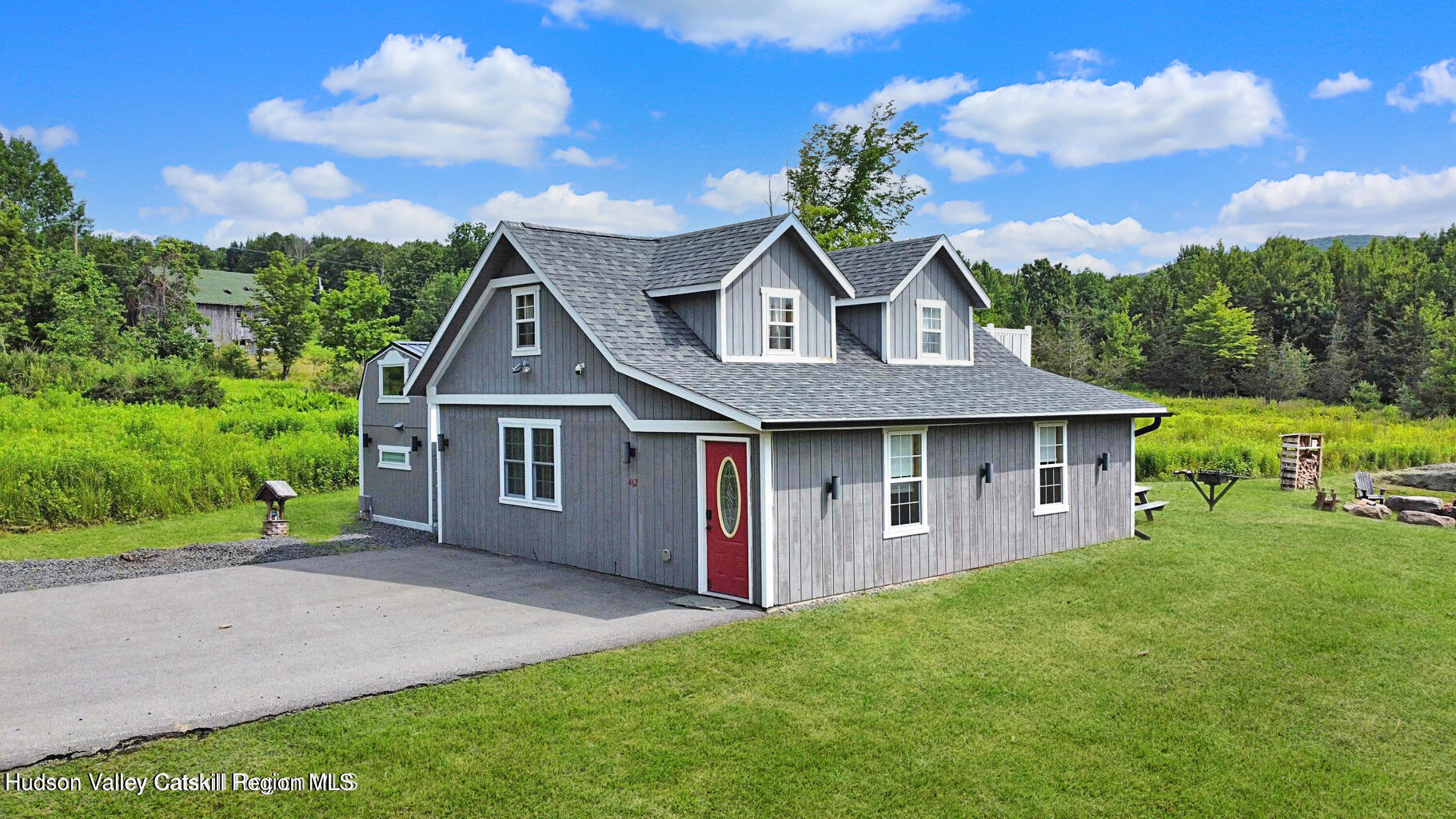462 Dent Road Prattsville, NY 12468 - Photo 23 of 32 a front view of a house with a yard and garage