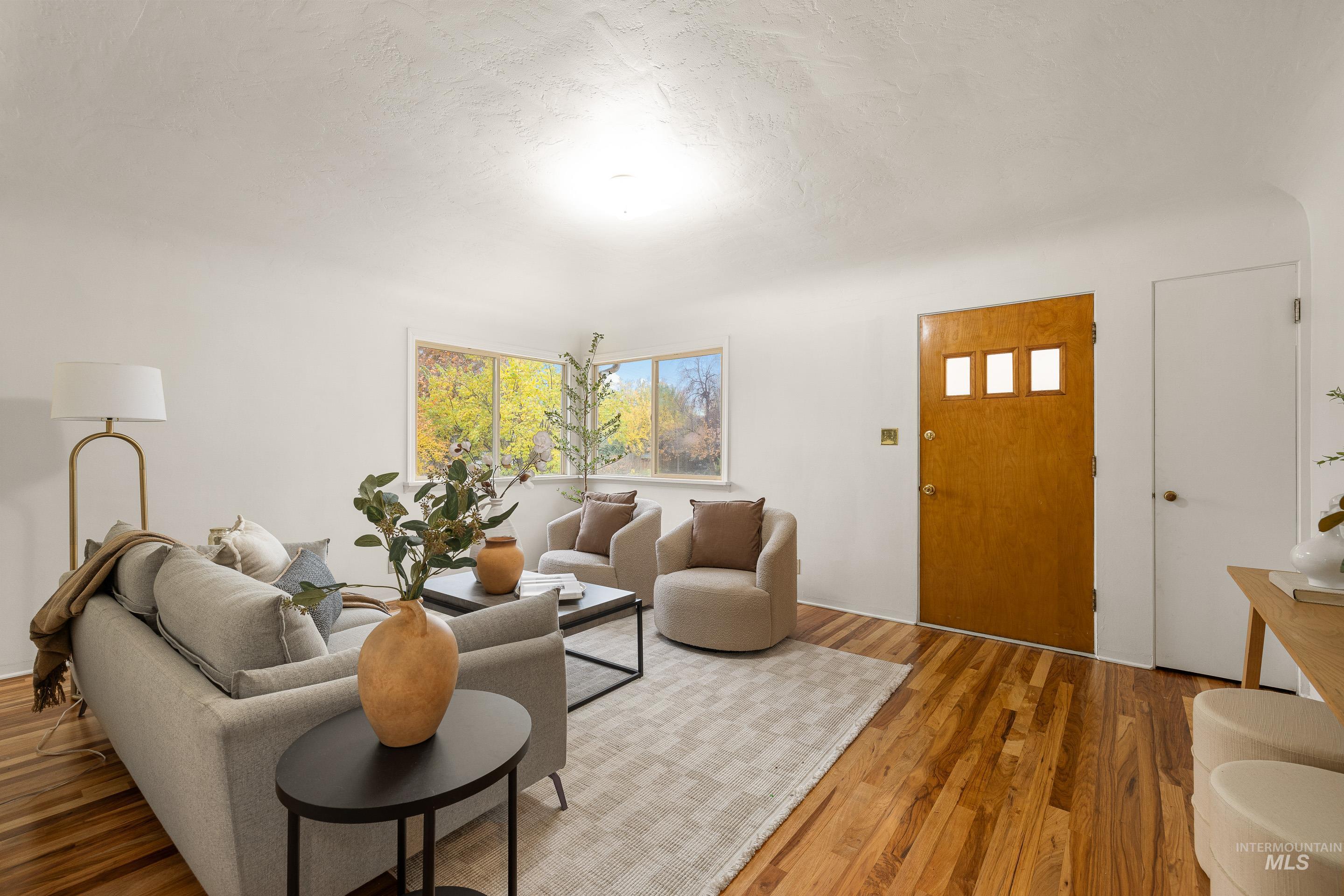 1006 Forrest Street Boise, ID 83705 - Photo 1 of 1 Living room with wood finished floors and a textured ceiling