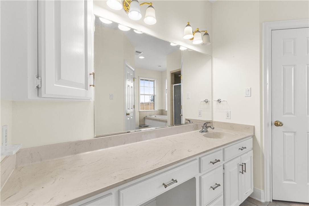 2120 Hohenwalde School Road Brenham, TX 77833 - Photo 16 of 30 a bathroom with a sink vanity and mirror