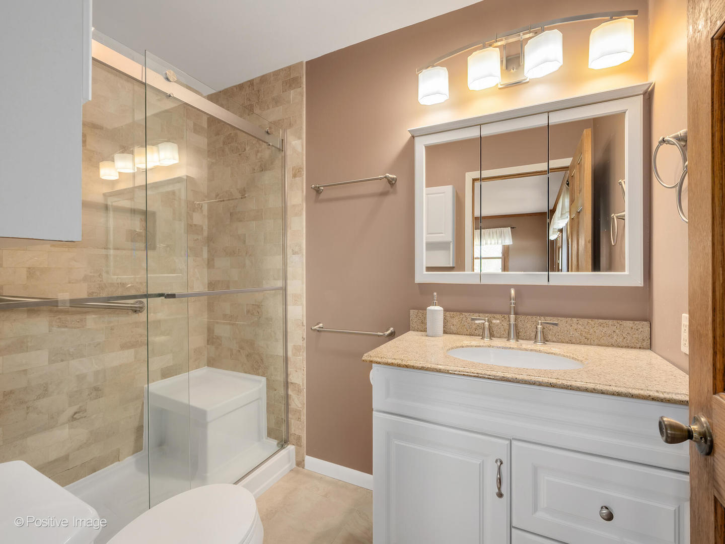 390 Arrowhead Trail Carol Stream, IL 60188 - Photo 12 of 25 a bathroom with a sink and a mirror