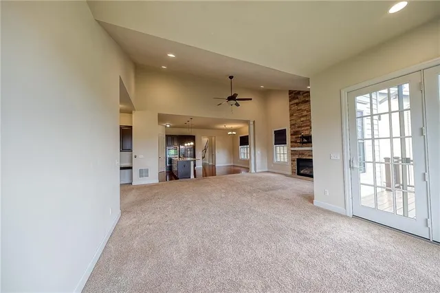 a view of river and deck with wooden floor and lake view