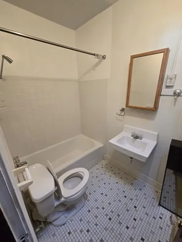a view of room with hardwood floor and window