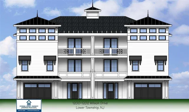 a front view of a residential apartment building with a yard