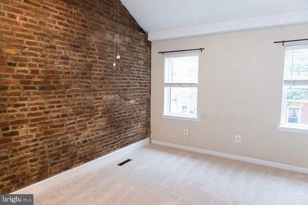 927 Binney Street Baltimore, MD 21224 - Photo 23 of 53 Primary bedroom in front of house