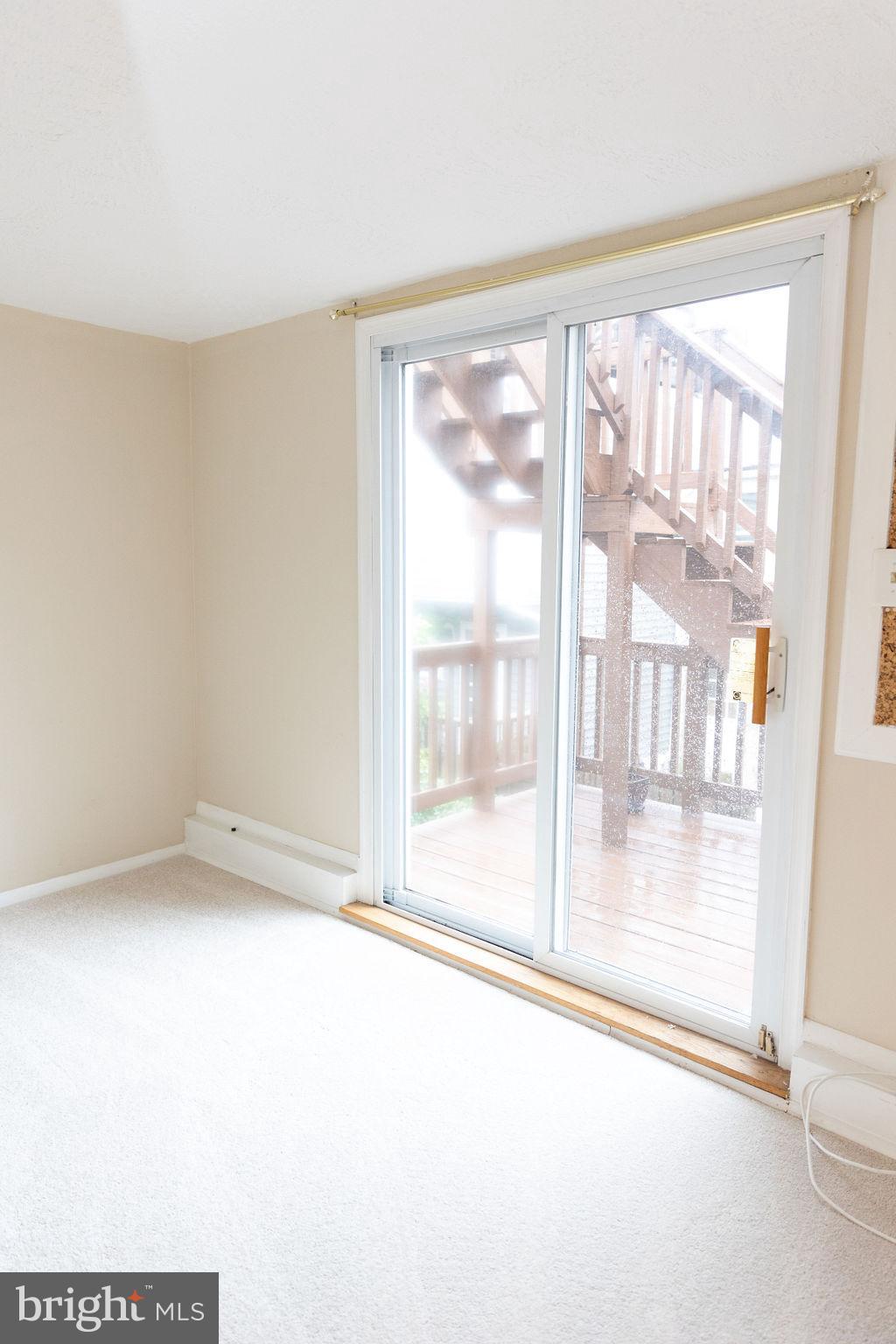 927 Binney Street Baltimore, MD 21224 - Photo 35 of 53 Second bedroom with rooftop deck access