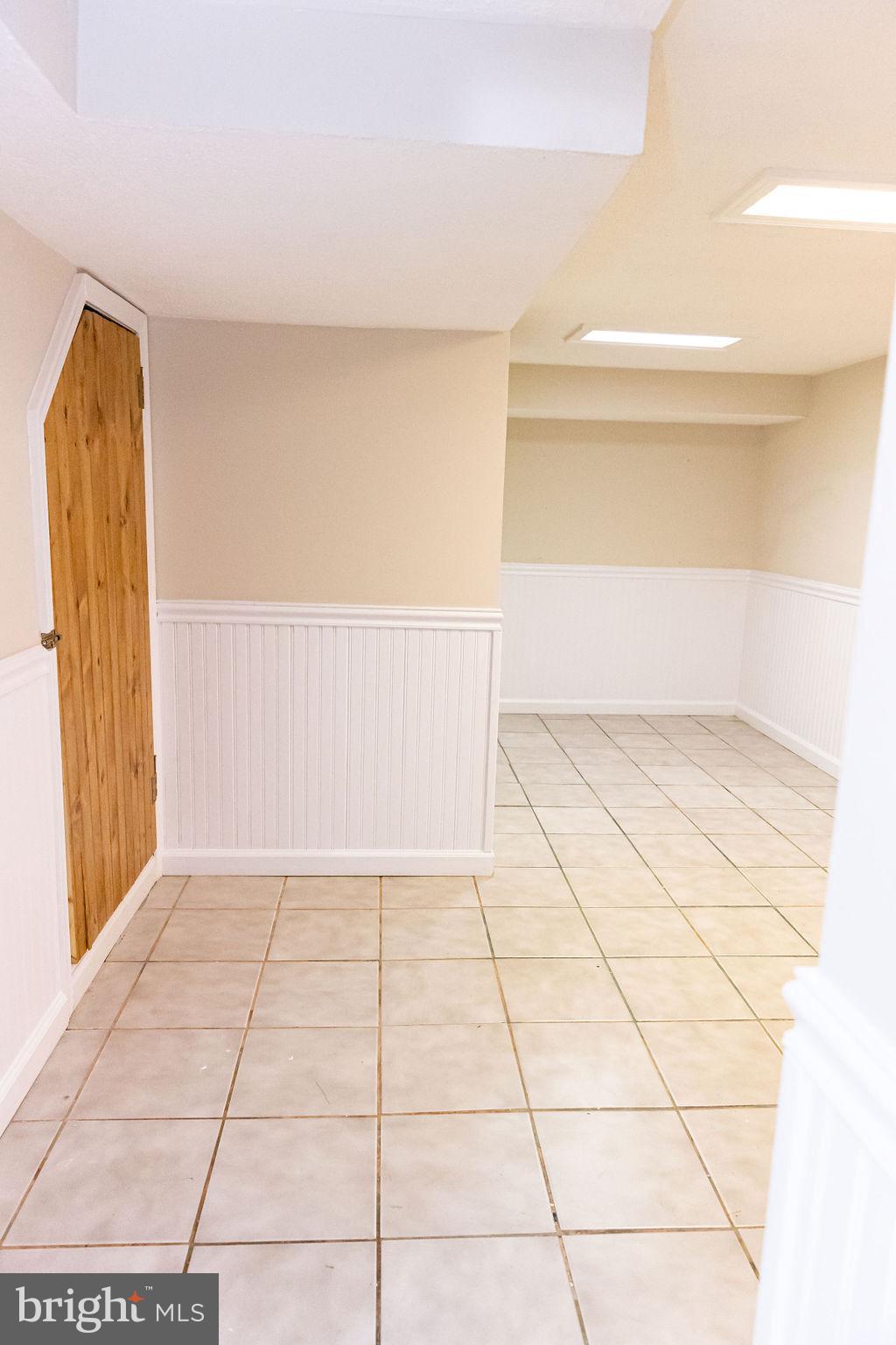 927 Binney Street Baltimore, MD 21224 - Photo 46 of 53 Finished basement for additional living space