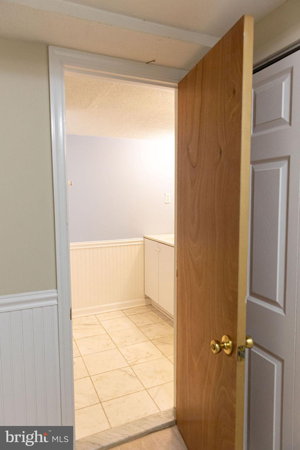 927 Binney Street Baltimore, MD 21224 - Photo 50 of 53 Door to basement full bathroom