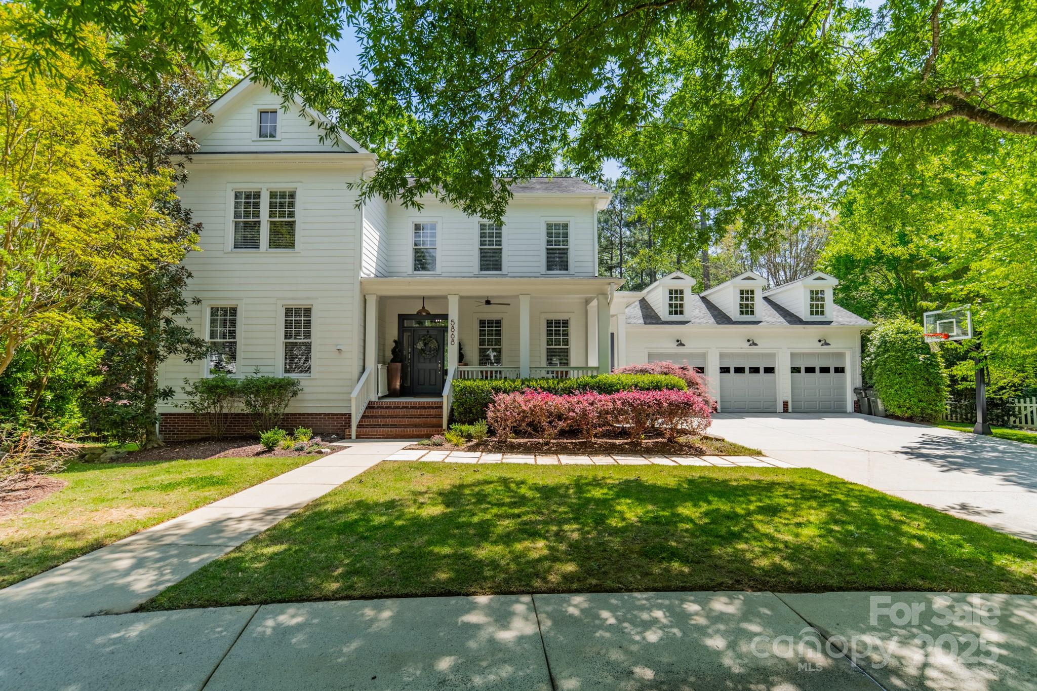 5868 Savona Terrace Fort Mill, SC 29708 - Photo 1 of 46 a front view of a house with a yard and garage