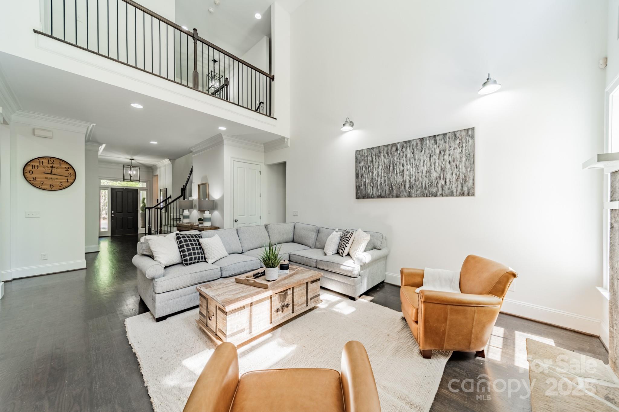 5868 Savona Terrace Fort Mill, SC 29708 - Photo 13 of 46 a living room with furniture and a painting on the wall