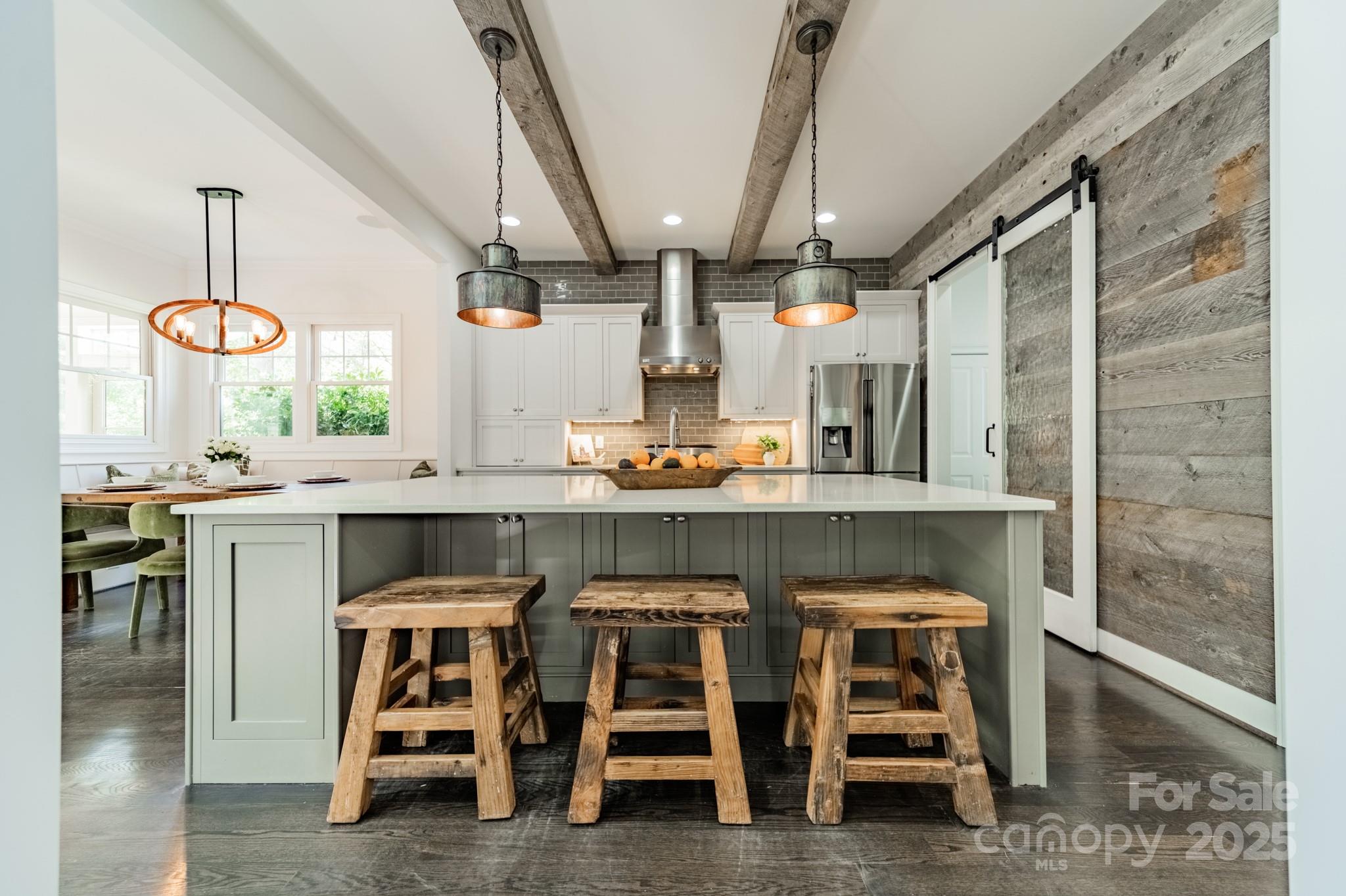 5868 Savona Terrace Fort Mill, SC 29708 - Photo 17 of 46 a kitchen with a dining table chairs sink and cabinets