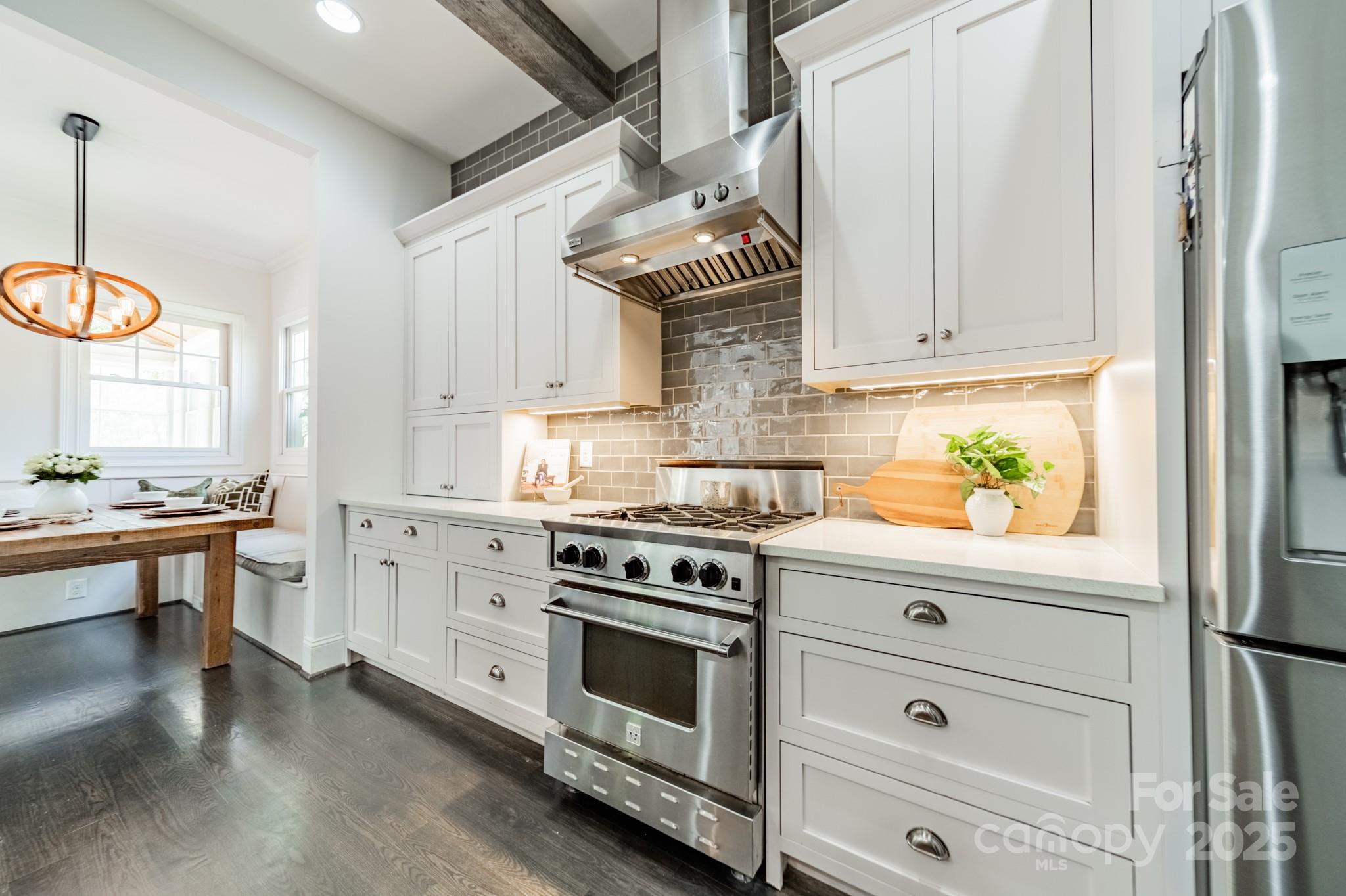 5868 Savona Terrace Fort Mill, SC 29708 - Photo 20 of 46 a kitchen with stainless steel appliances white cabinets and a window