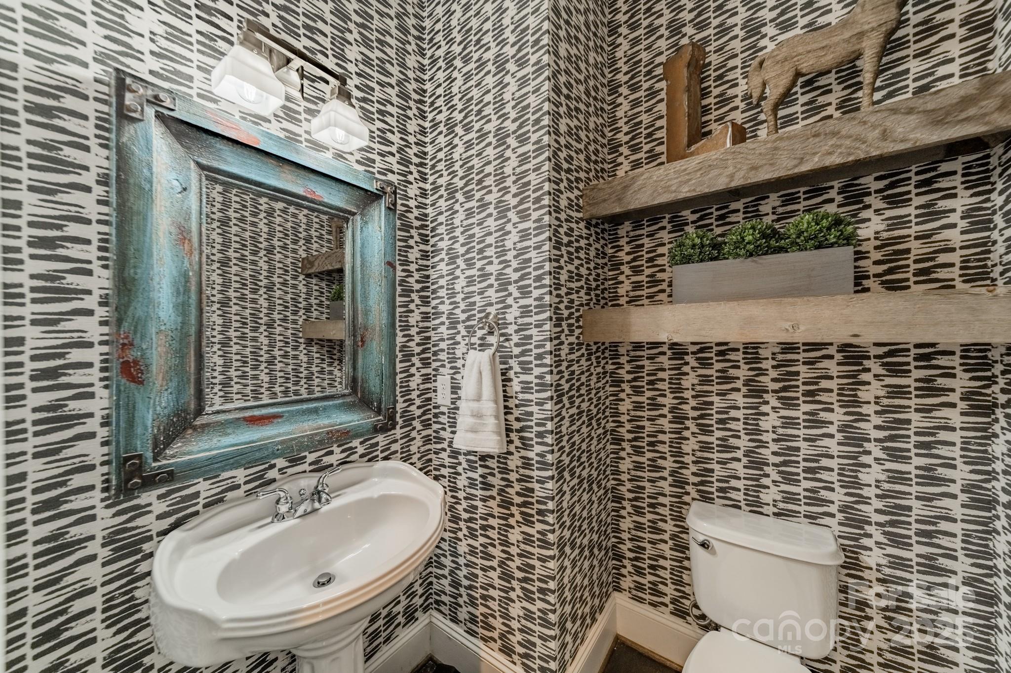 5868 Savona Terrace Fort Mill, SC 29708 - Photo 28 of 46 a bathroom with a sink and a mirror