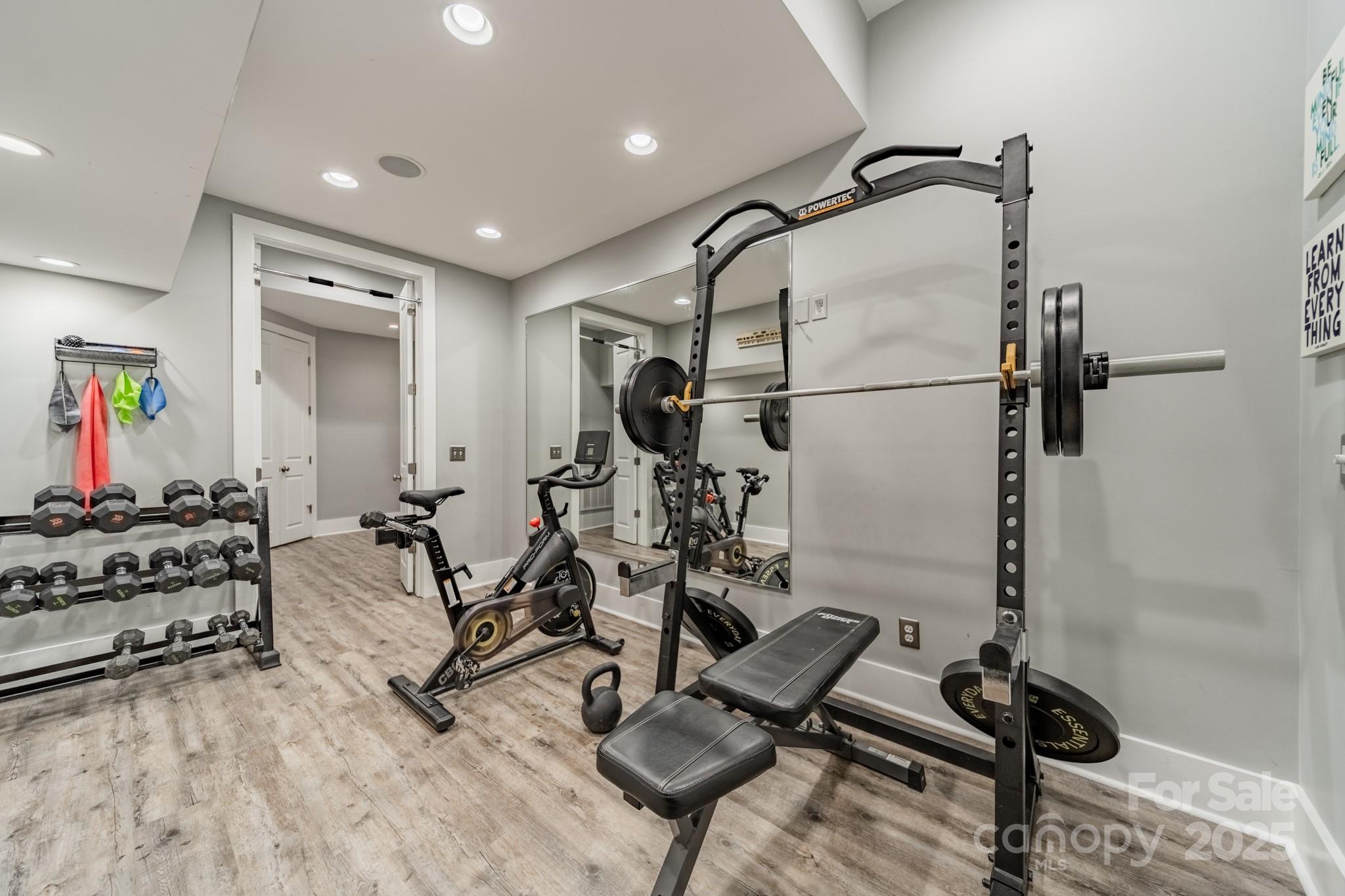 5868 Savona Terrace Fort Mill, SC 29708 - Photo 35 of 46 a room with gym equipment and a mirror