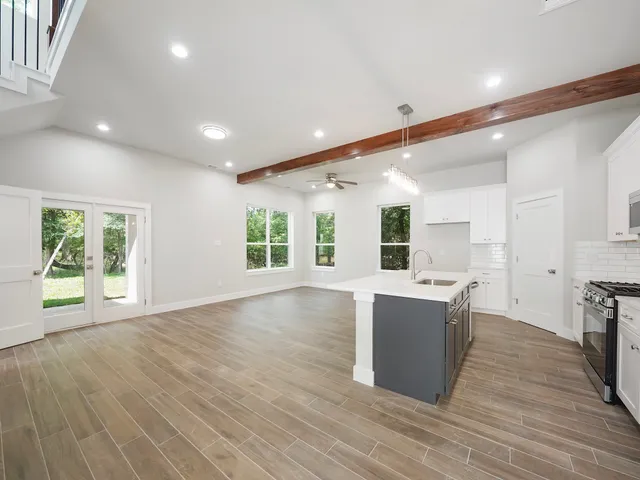 a view of kitchen with cabinets and wooden floor