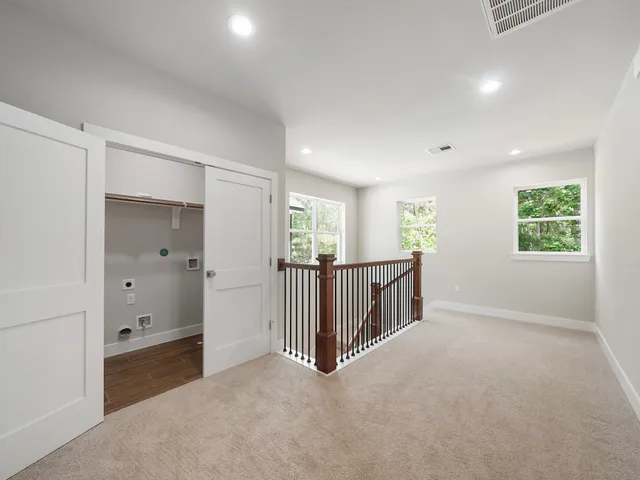 a view of a hallway with windows