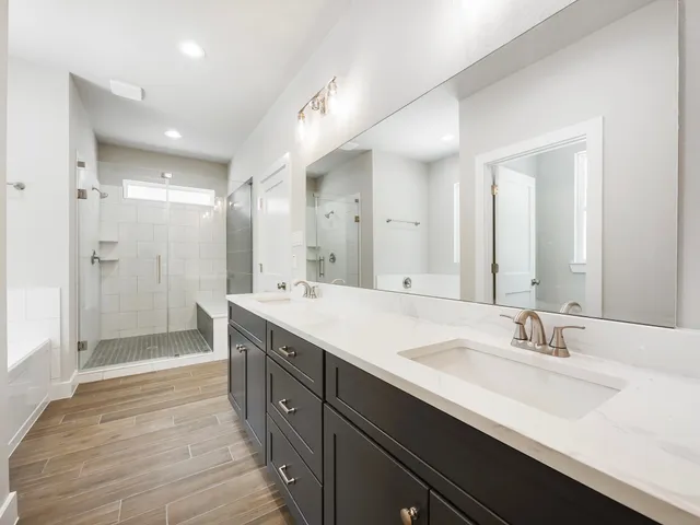 a bathroom with a shower and a sink