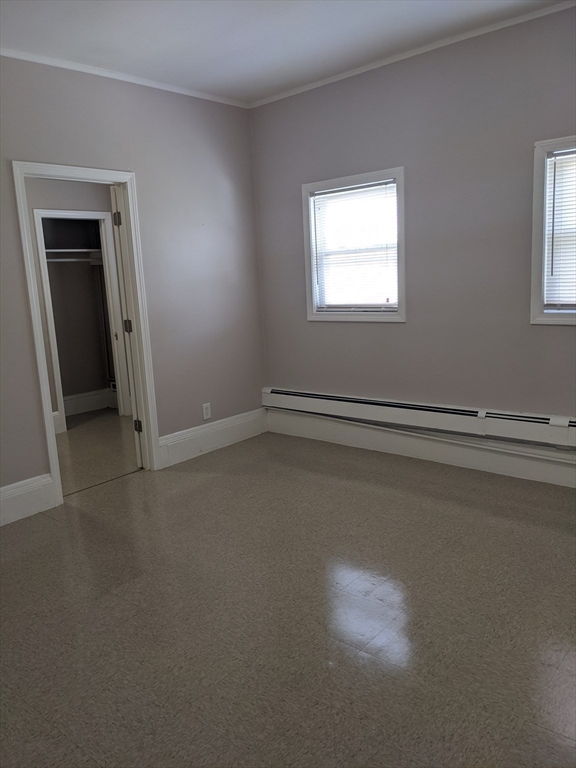 66 Batchelder Street, Unit 2 Boston, MA 02119 - Photo 7 of 8 an empty room with windows
