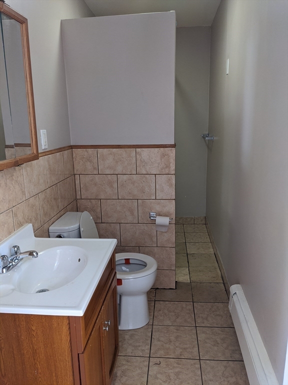66 Batchelder Street, Unit 2 Boston, MA 02119 - Photo 8 of 8 a bathroom with a sink and a toilet