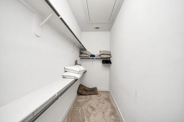 a kitchen with a refrigerator a sink dishwasher a stove and white cabinets with wooden floor