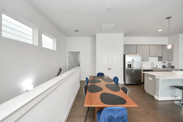 a large kitchen with kitchen island a sink stainless steel appliances and cabinets