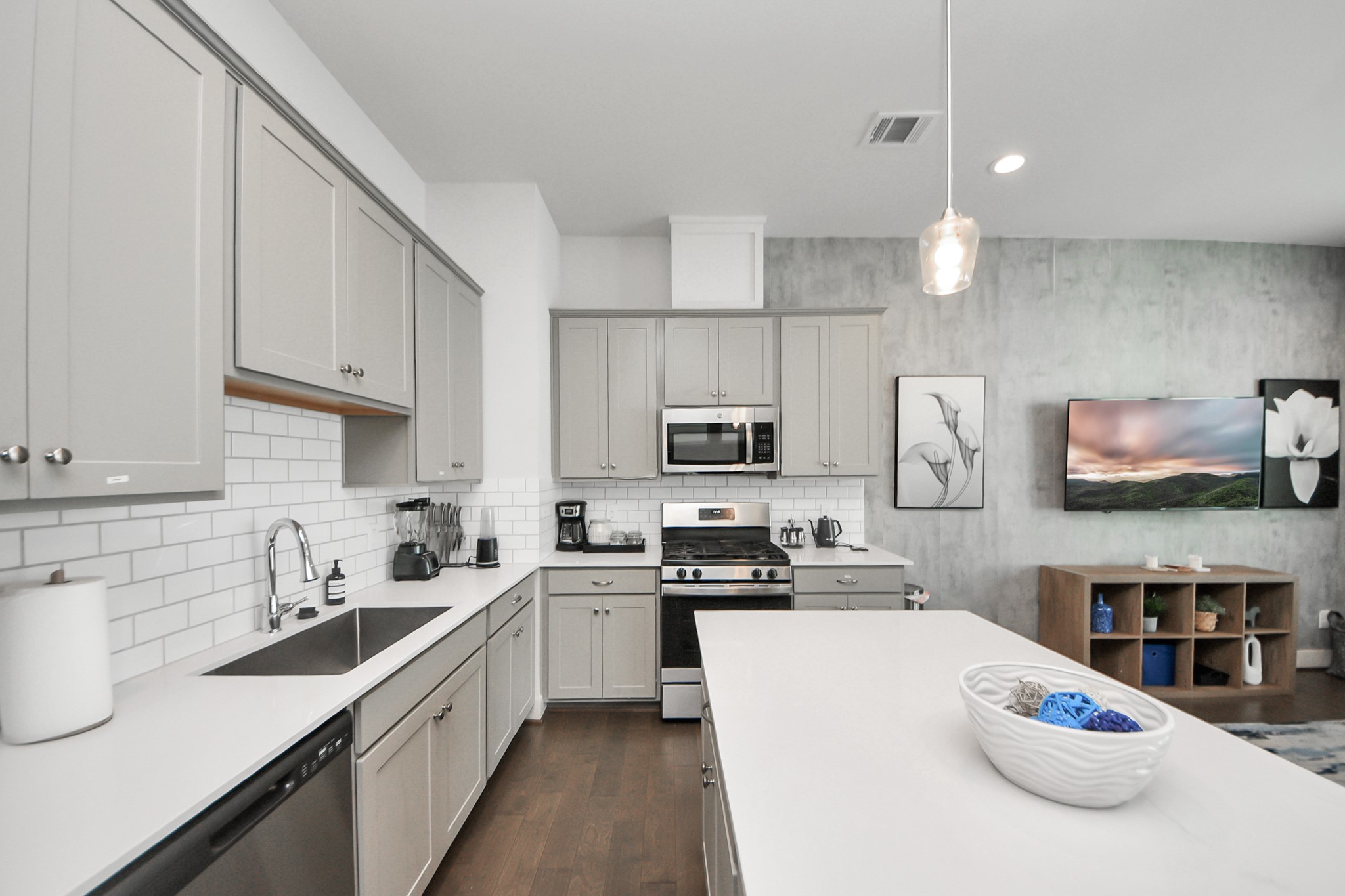 3642 Griggs Road Houston, TX 77021 - Photo 21 of 39 a kitchen with stainless steel appliances a sink a stove top oven a counter space and cabinets