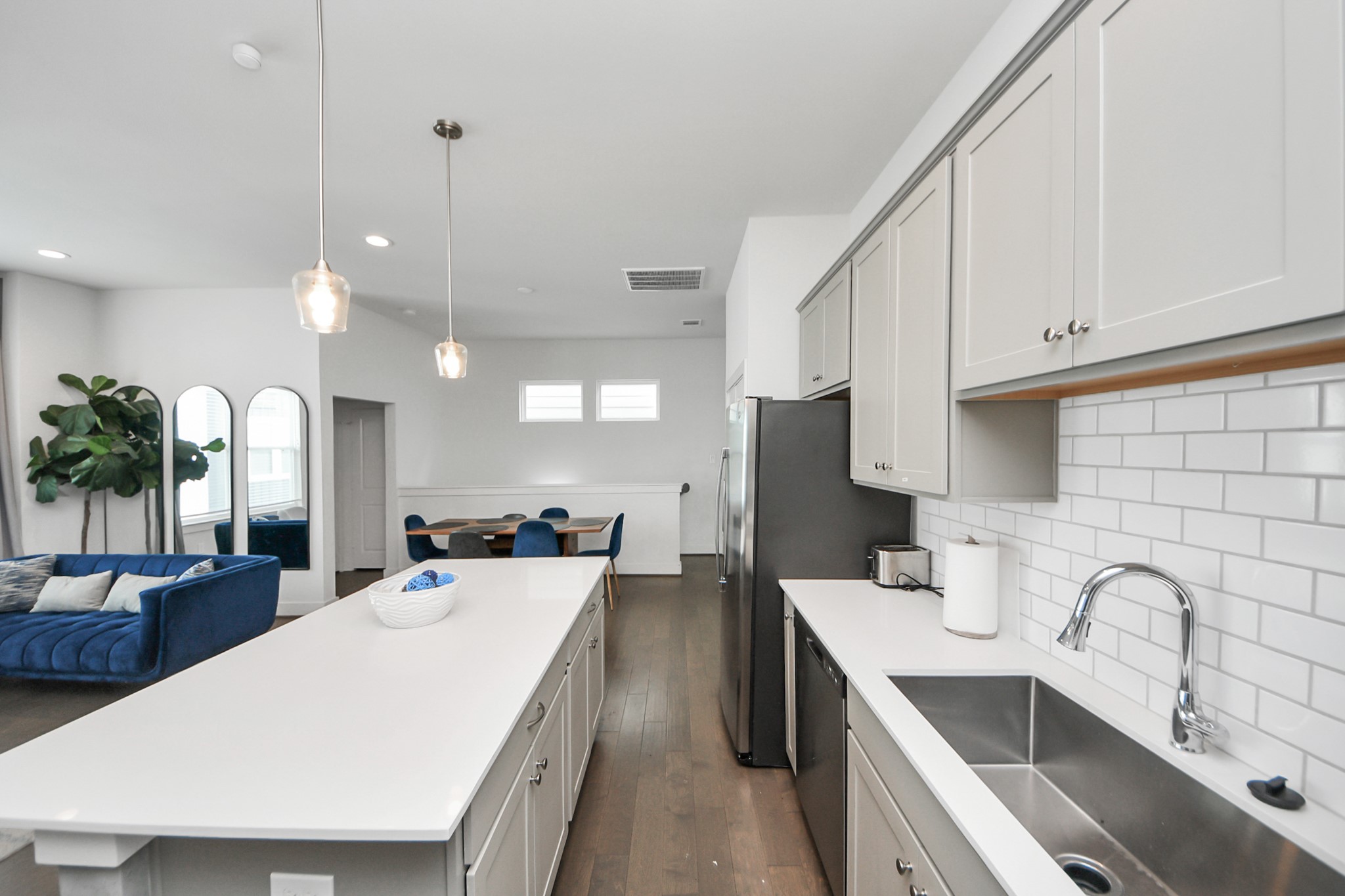 3642 Griggs Road Houston, TX 77021 - Photo 23 of 39 a large kitchen with kitchen island a sink stainless steel appliances and cabinets