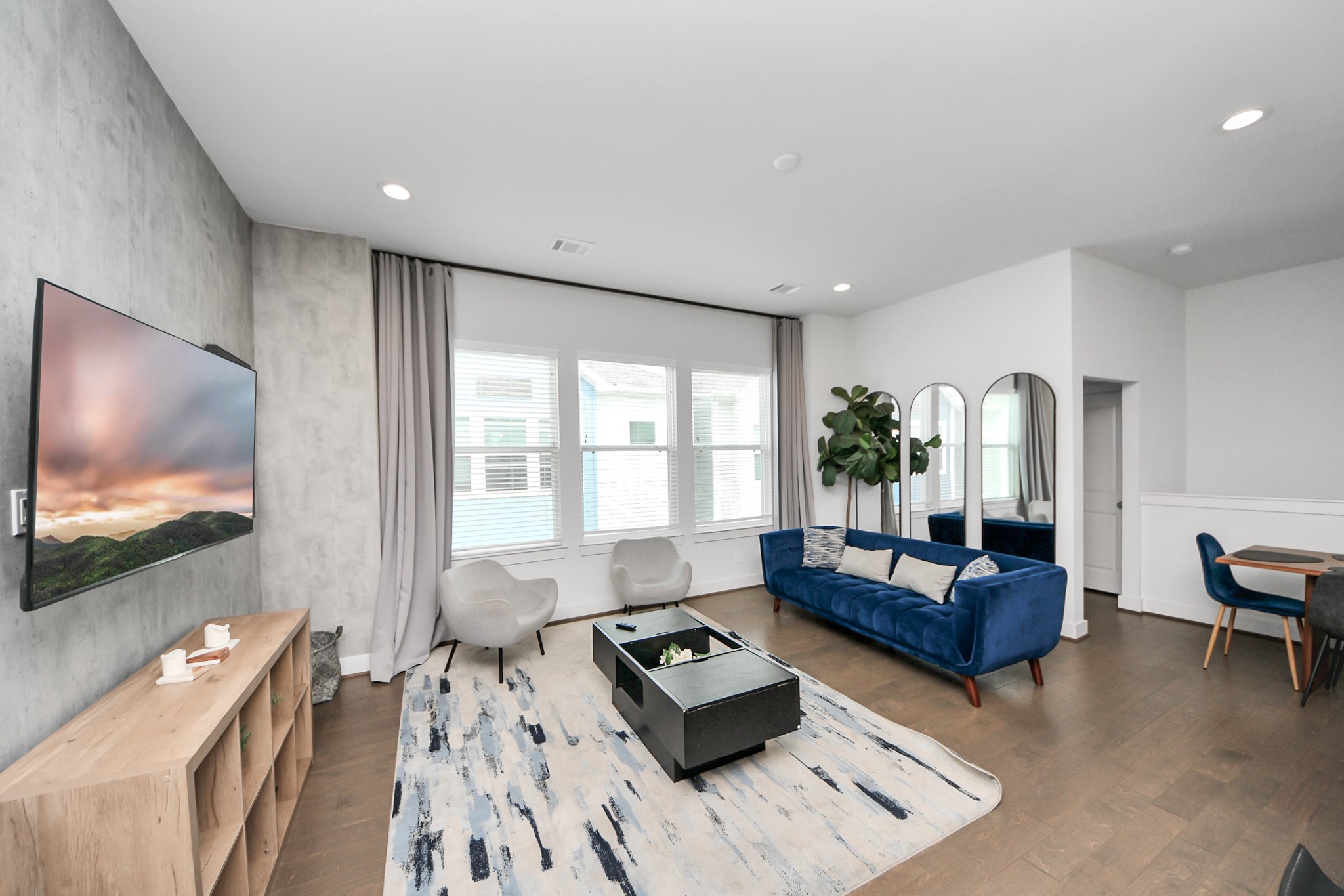 3642 Griggs Road Houston, TX 77021 - Photo 26 of 39 a living room with furniture and a flat screen tv