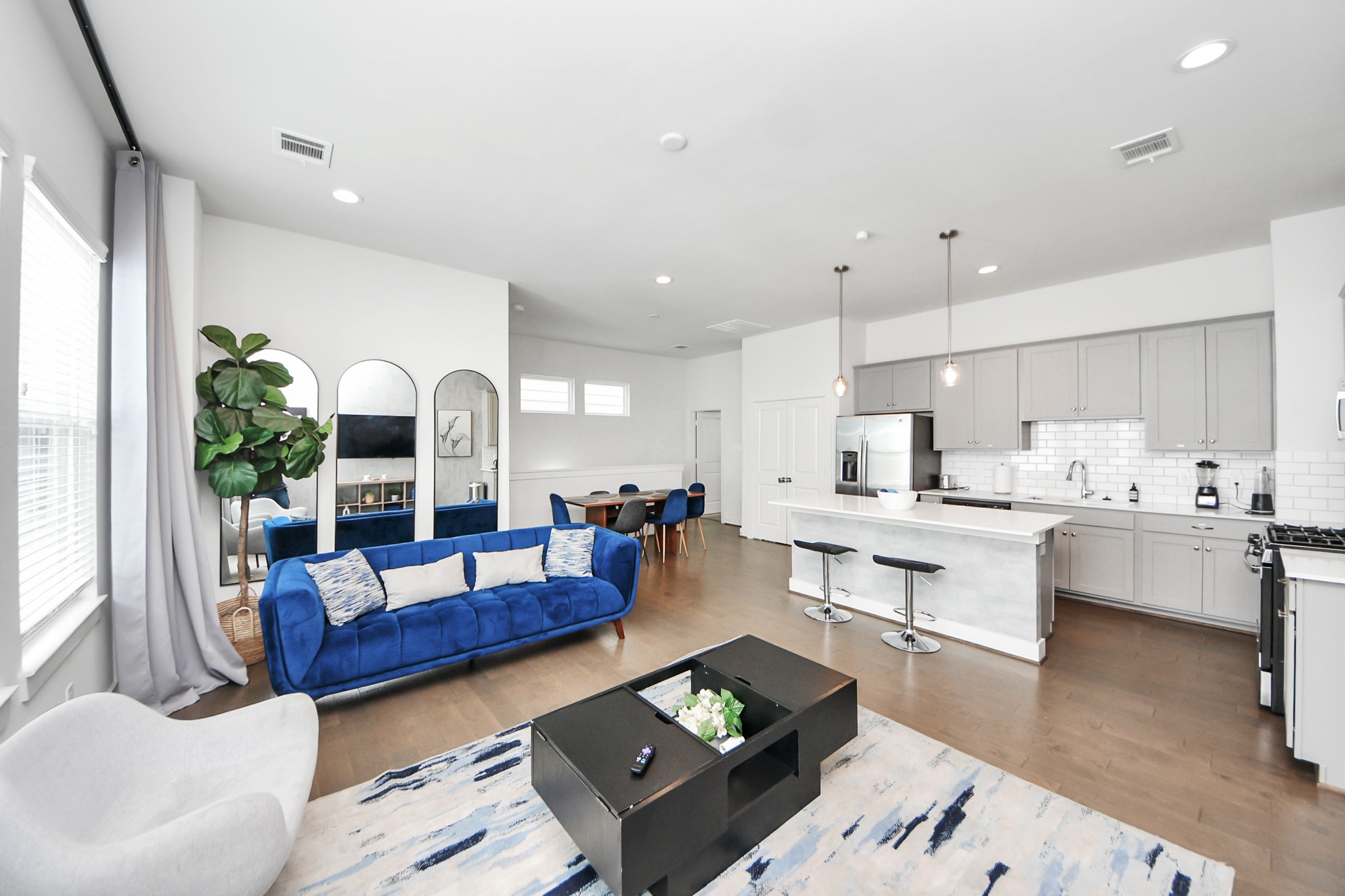 3642 Griggs Road Houston, TX 77021 - Photo 28 of 39 a living room with kitchen island furniture and a wooden floor