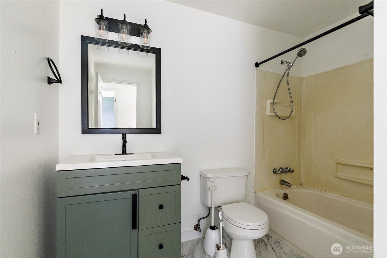 1146 Ridgeway Drive Oak Harbor, WA 98277 - Photo 16 of 25 a bathroom with a toilet sink vanity tub and shower