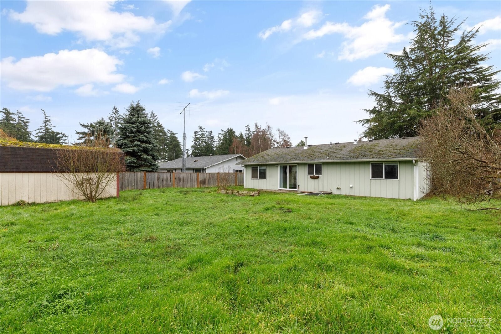 1146 Ridgeway Drive Oak Harbor, WA 98277 - Photo 23 of 25 a view of a yard in front of a house with a big yard