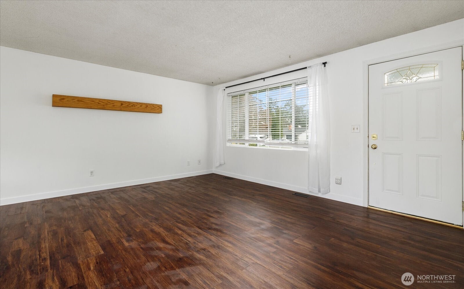1146 Ridgeway Drive Oak Harbor, WA 98277 - Photo 4 of 25 an empty room with wooden floor and windows