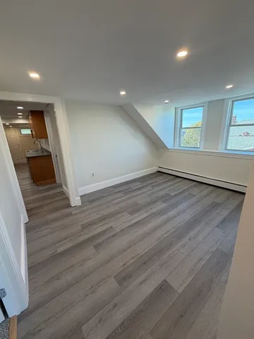 a view of a livingroom with wooden floor
