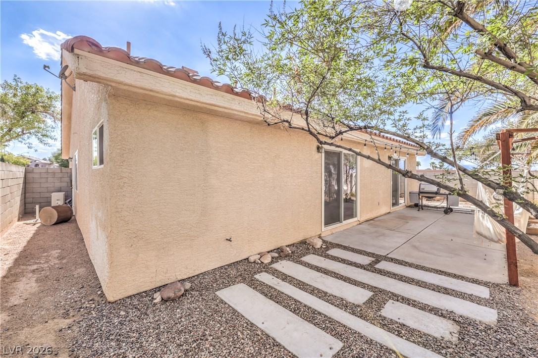 1900 Cardinal Point Street Henderson, NV 89012 - Photo 27 of 32 A spacious backyard patio provides ample room for outdoor enjoyment and relaxation.