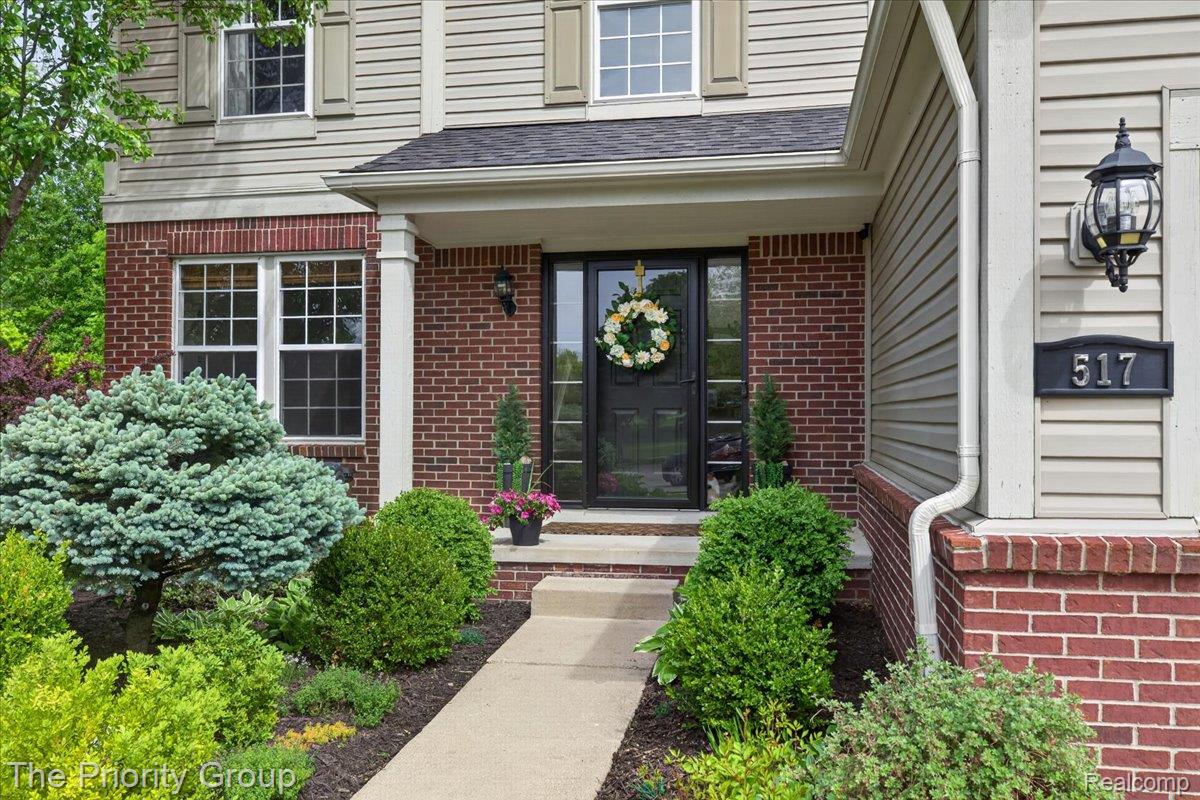 517 Deer Valley Road Holly, MI 48442 - Photo 4 of 61 Front walkway with perennials and covered porch!