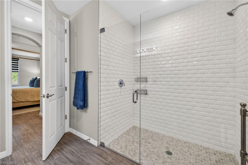 14567 Edgewater Circle Naples, FL 34114 - Photo 20 of 44 a bathroom with a shower