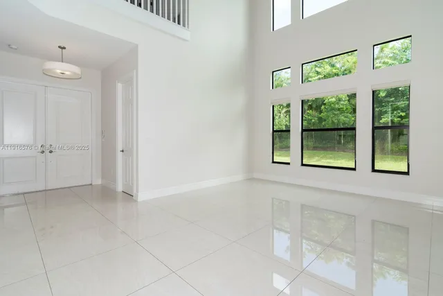 a kitchen with stainless steel appliances granite countertop a sink and a stove