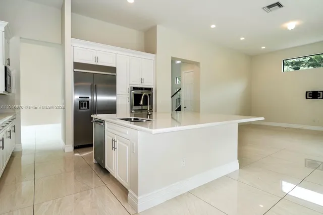 an empty room with a ceiling fan