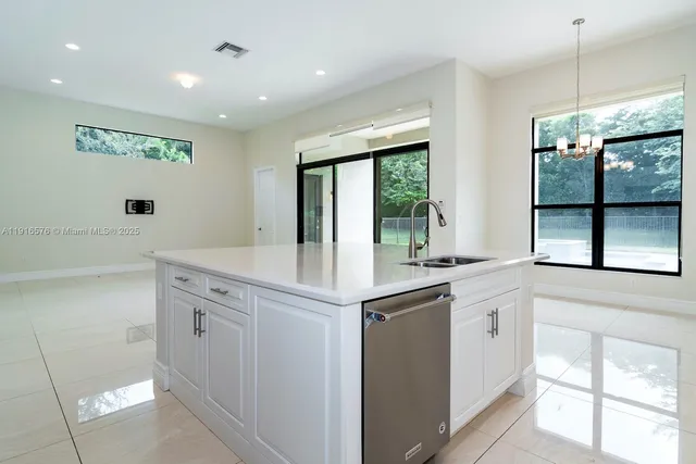 a view of an empty room with glass door