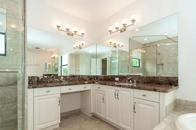 an empty room with windows and entrance