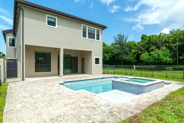 a view of a swimming pool with a yard