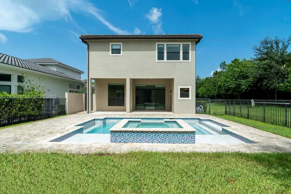 a view of swimming pool with a yard