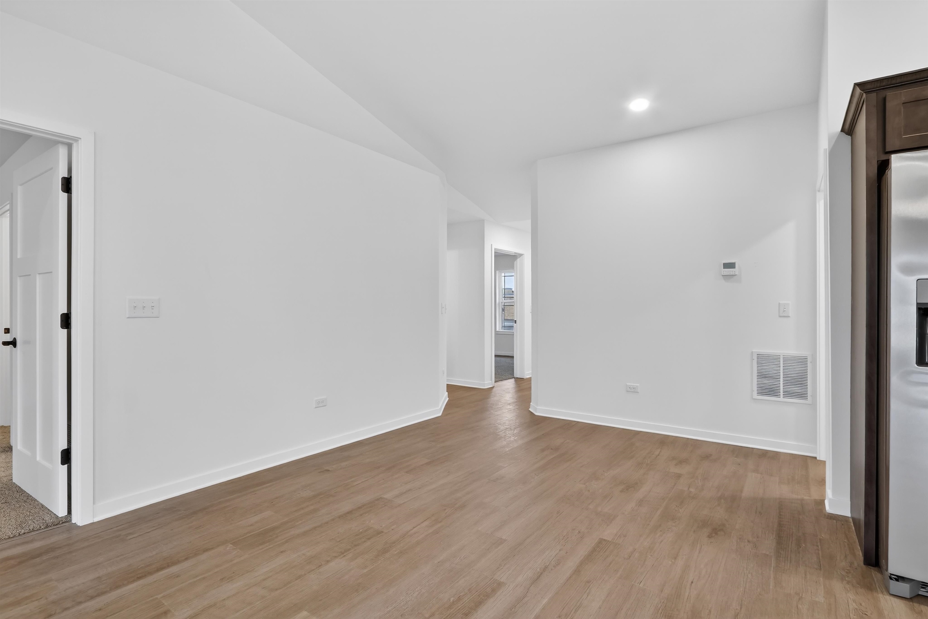 307 West South Street Durand, IL 61024 - Photo 12 of 27 a view of an empty room with wooden floor and a window