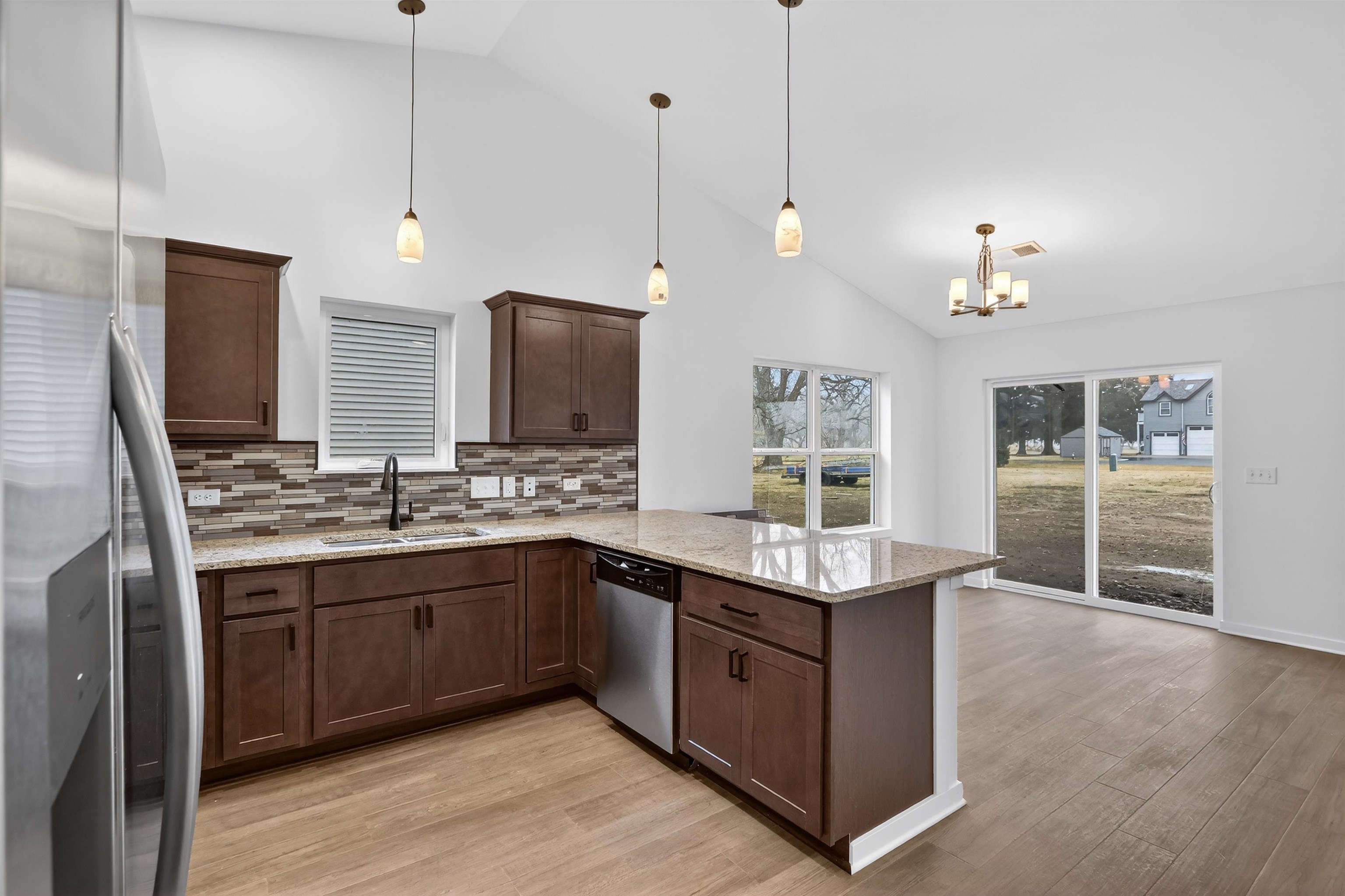 307 West South Street Durand, IL 61024 - Photo 14 of 27 a kitchen with center island and stainless steel appliances