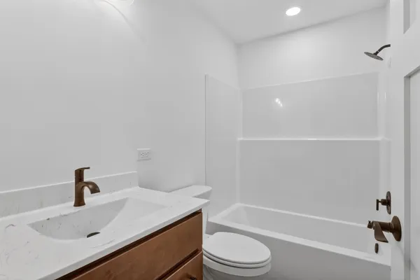 a bathroom with a sink toilet and vanity